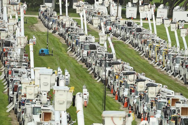 Utility trucks near The Villages, Fla., on Tuesday. Elsa is expected to hit Florida’s Gulf Coast on Wednesday.
